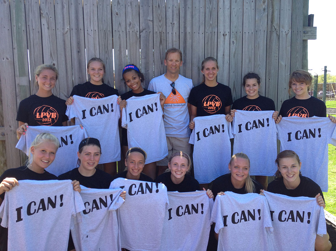 A local sports team poses with Beyond Boundaries Challenge Course Shirts.